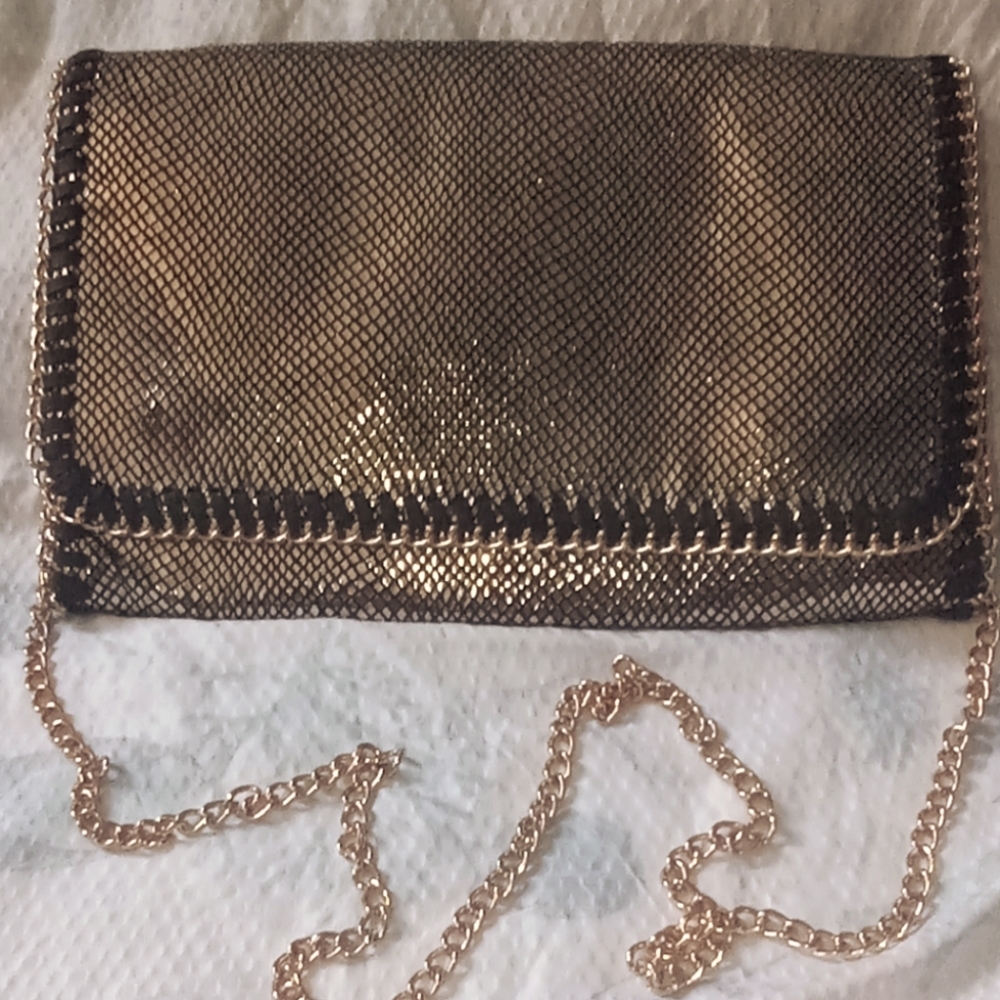 Gold crossbody purse with new gold chain.
